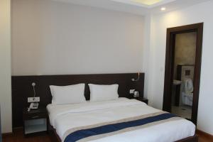 Letto o letti in una camera di Hotel Mega & Apartment