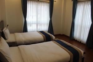 Letto o letti in una camera di Hotel Mega & Apartment