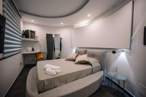 Postel nebo postele na pokoji v ubytování B&BIO SPA