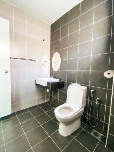 a bathroom with a toilet and a sink at Golden Sweet Home @ CH Golden Hills (Night Market) in Cameron Highlands