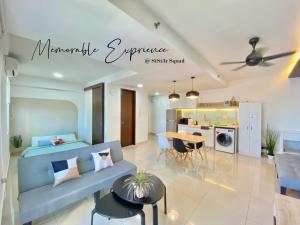 a living room with a blue couch and a table at Breezy 2-10Pax 2R2B Trefoil Setia City Shah Alam SiS Homestay in Shah Alam