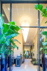 a lobby with plants in a building at W-Aldorf in Casablanca
