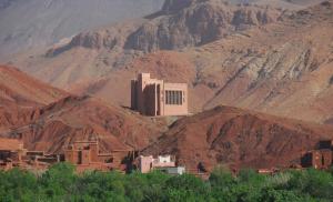 a large building in the middle of a mountain at Gite Amoudou in Ouarzazate