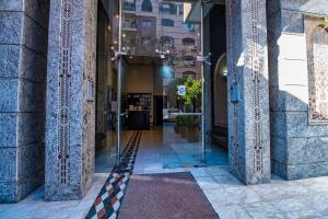a hallway of a building with a glass door at Harmony Inn Entire 2 bedroom apartment in Marrakech