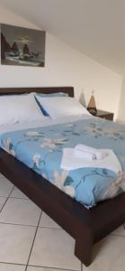 Postel nebo postele na pokoji v ubytování Etna mare