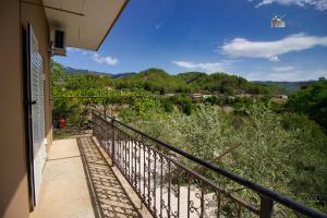 a balcony of a house with a view at Honey-House Kastrioti Adventures in Përmet