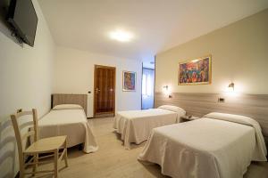 Postel nebo postele na pokoji v ubytování Hotel da Romagnolo