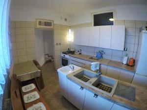 a small kitchen with a sink and a stove at Apartamenty, mieszkanie na wynajem, 110m2, w Świdniku k Lublina in Świdnik