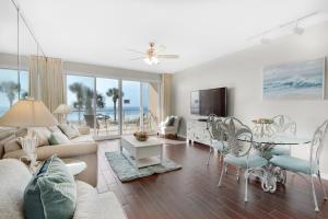 a living room with a couch and a table at Sterling Sands 111 in Destin