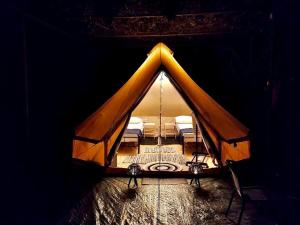 a room with a tent with two beds in it at XeniCamp-Retreat in Nafplio