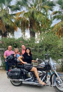 a group of people sitting on a motorcycle at XeniCamp-Retreat in Nafplio