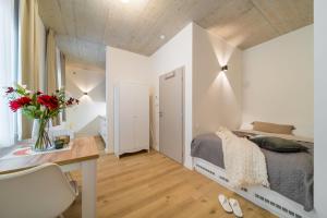 Postel nebo postele na pokoji v ubytování Rákosárna Suites & Apartments