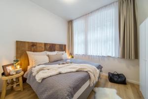 Postel nebo postele na pokoji v ubytování Rákosárna Suites & Apartments