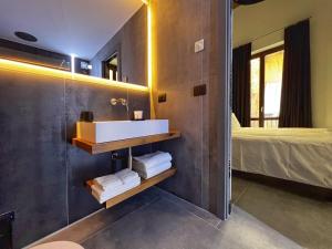 A bed or beds in a room at Sant'Andrea - Luxury Rooms in Vucciria