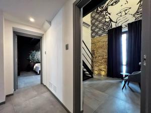 A bed or beds in a room at Sant'Andrea - Luxury Rooms in Vucciria