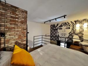 A bed or beds in a room at Sant'Andrea - Luxury Rooms in Vucciria