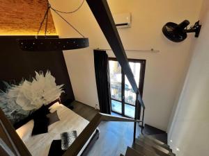 A bed or beds in a room at Sant'Andrea - Luxury Rooms in Vucciria