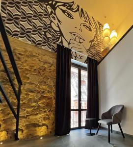 A seating area at Sant'Andrea - Luxury Rooms in Vucciria