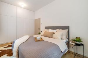 Postel nebo postele na pokoji v ubytování Rákosárna Suites & Apartments