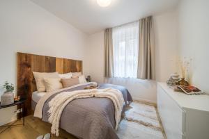 Postel nebo postele na pokoji v ubytování Rákosárna Suites & Apartments
