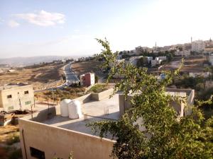 a view of a city from the top of a building at Furnished apartment for rent in jarash شقة مفروشة للإيجار في جرش in Jerash