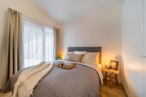 Postel nebo postele na pokoji v ubytování Rákosárna Suites & Apartments