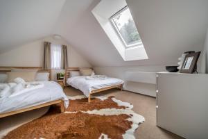 Postel nebo postele na pokoji v ubytování Rákosárna Suites & Apartments