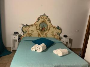 A bed or beds in a room at Camera graziosa