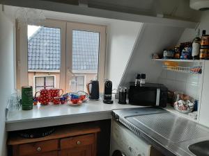 Kuchyň nebo kuchyňský kout v ubytování Logement het Herenwaltje
