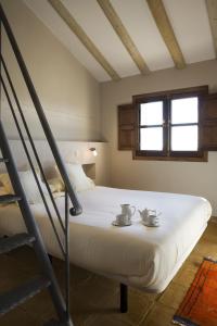 Ένα ή περισσότερα κρεβάτια σε δωμάτιο στο Hotel Rural La Data