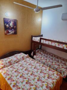 Postel nebo postele na pokoji v ubytování Apartamentos Victoria