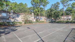 a tennis court in front of some houses at Spacious Cozy Condo! Perfect for longer stays in Mobile