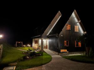 a barn at night with the lights on at Boutique Villa Pearl of Plitvice, Plitvice Lakes in Plitvica selo