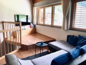 a living room with a couch and a table at Appartement Bettina in Schoppernau