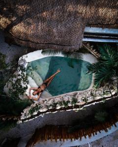 Hotel Muaré Tulum Wellness and Spa内部或周边的泳池