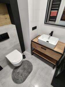Fotografia z galérie ubytovania Uroczy apartament z miejscem na auto w garażu vo Varšave