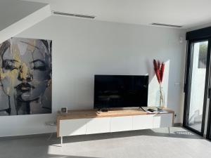 Telewizja i/lub zestaw kina domowego w obiekcie Casa 34