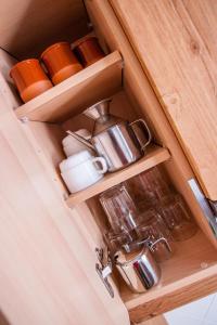 a drawer with cups and mugs in a cabinet at Colonia Apartamento Rural in Bellmunt de Ciurana