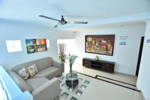 a living room with a couch and a table at Hotel La Casa N. 3 in Montería