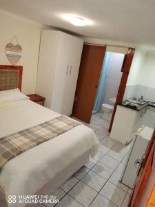 Postel nebo postele na pokoji v ubytování LaMavuso Guesthouse
