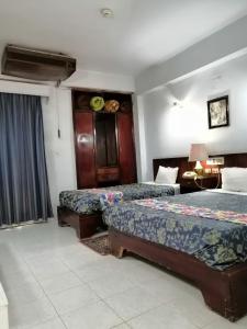 Postel nebo postele na pokoji v ubytování Windsor Hotel Luxor
