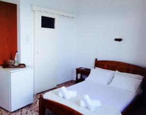 Posteľ alebo postele v izbe v ubytovaní Chrisopetro Rooms