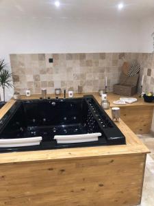 a kitchen with a black stove top on a counter at BellaVilla 309 in Sarrians