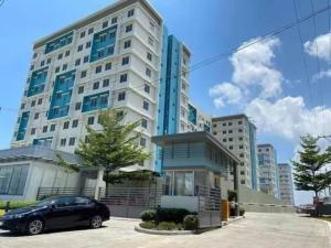 a car parked in front of a large building at Spacious 2 bedroom 42sqm condo unit in Iloilo City
