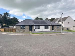 a house with a solar roof on a street at 4 Mote View-uk37497 in Sandhead