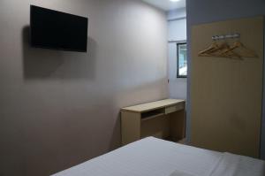 TV a/nebo společenská místnost v ubytování Unikarya Lodge