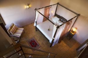 Rúm í herbergi á Hotel Rural La Data