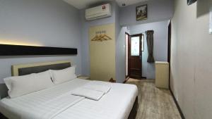Postel nebo postele na pokoji v ubytování Unikarya Lodge + 37 fotografií