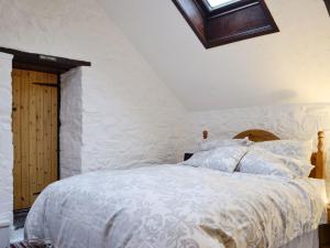 Postel nebo postele na pokoji v ubytování Tryal Cottage