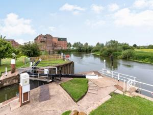 a boat is docked on a river at Studio - Uk34126 in Tewkesbury